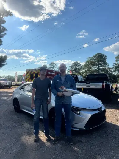 Happy GreenLight buyer with their vehicle