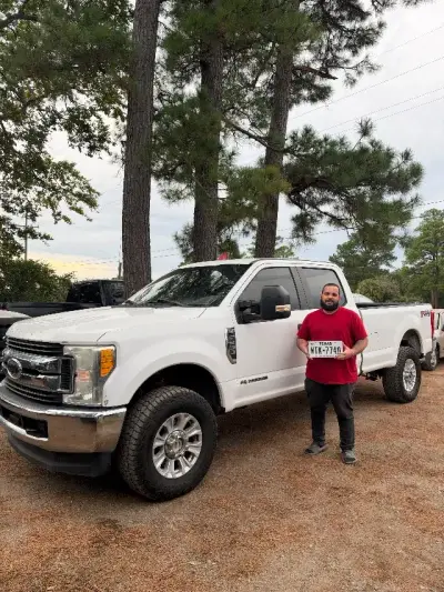 Happy GreenLight buyer with their vehicle