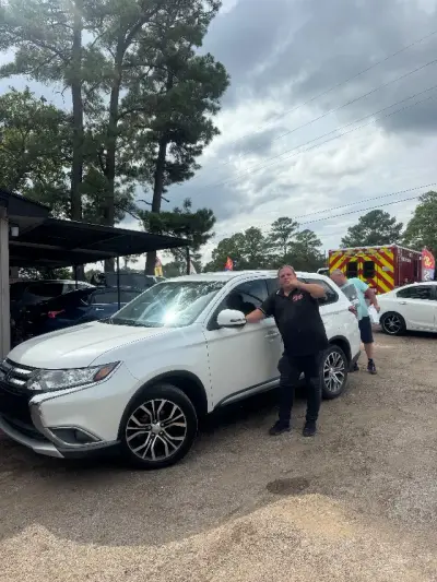 Happy GreenLight buyer with their vehicle